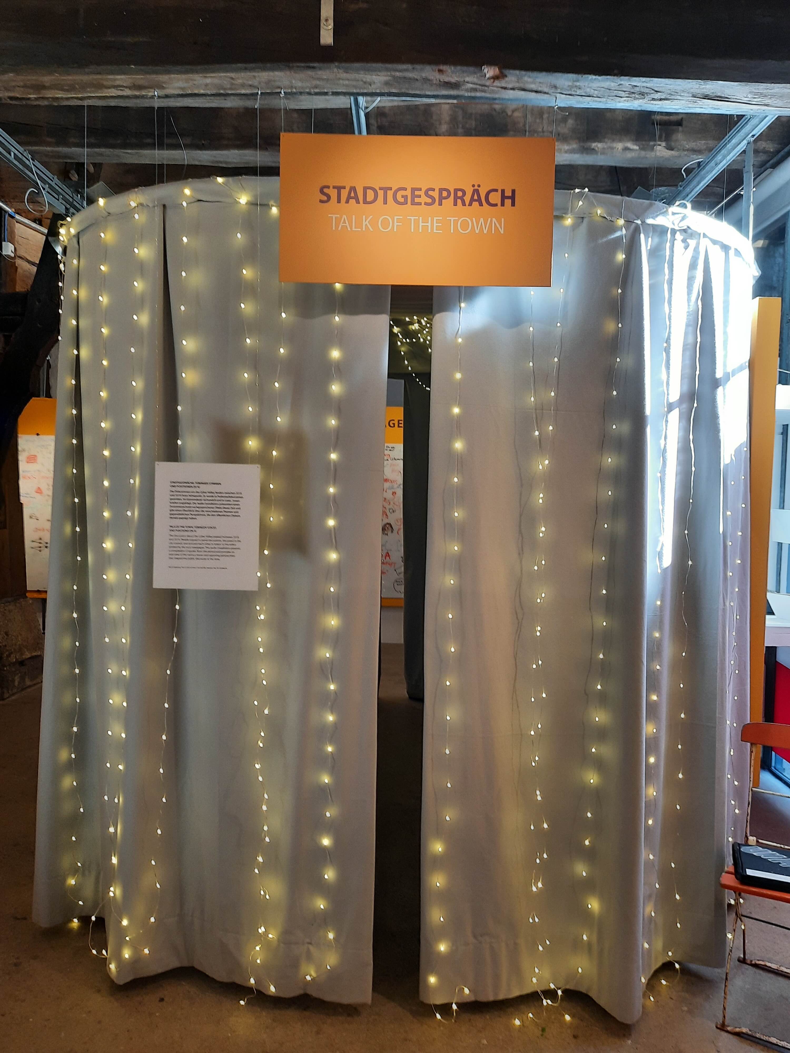 The Stadtgespräch — Talk of the Town installation with curtains and lights