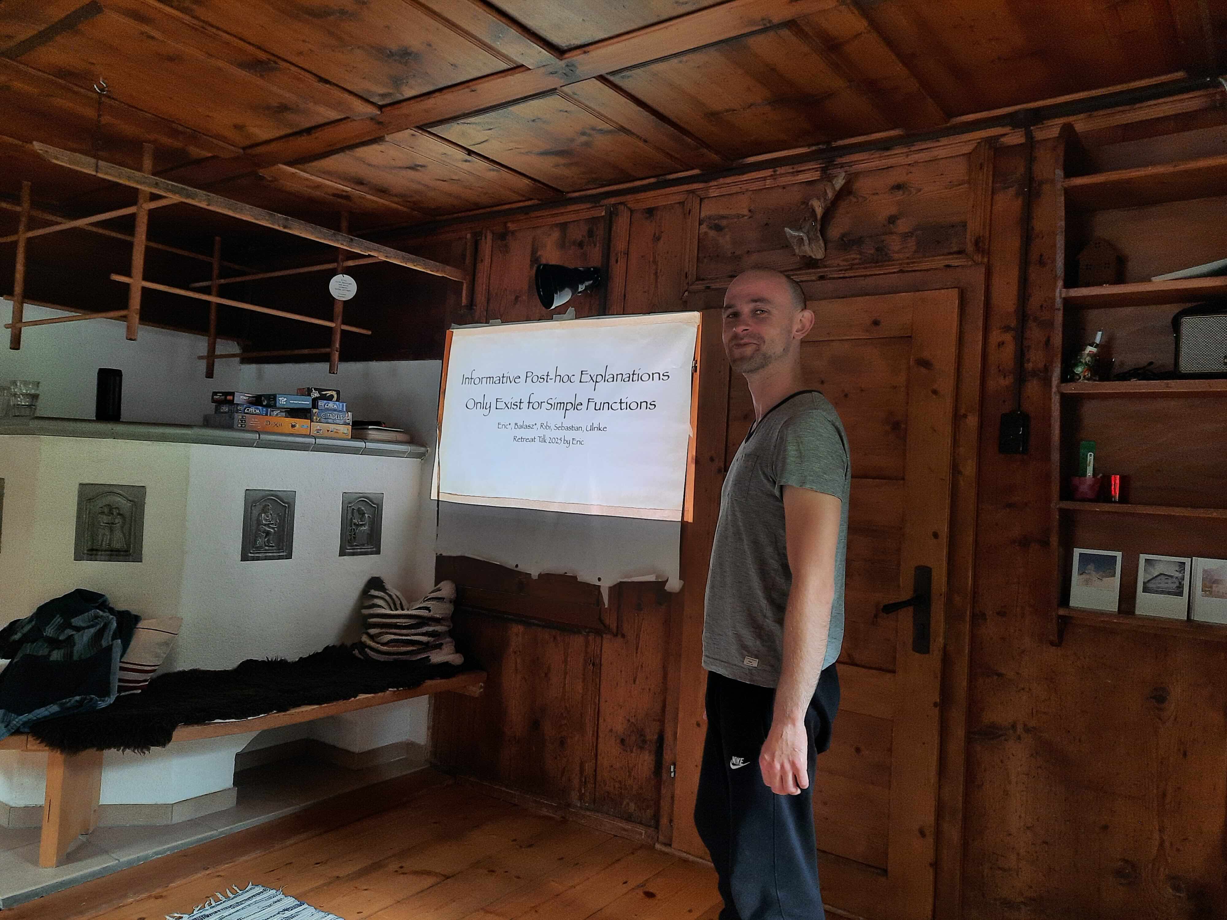 A group member presenting research on explainable machine learning during a retreat